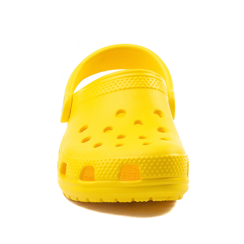 white and yellow crocs