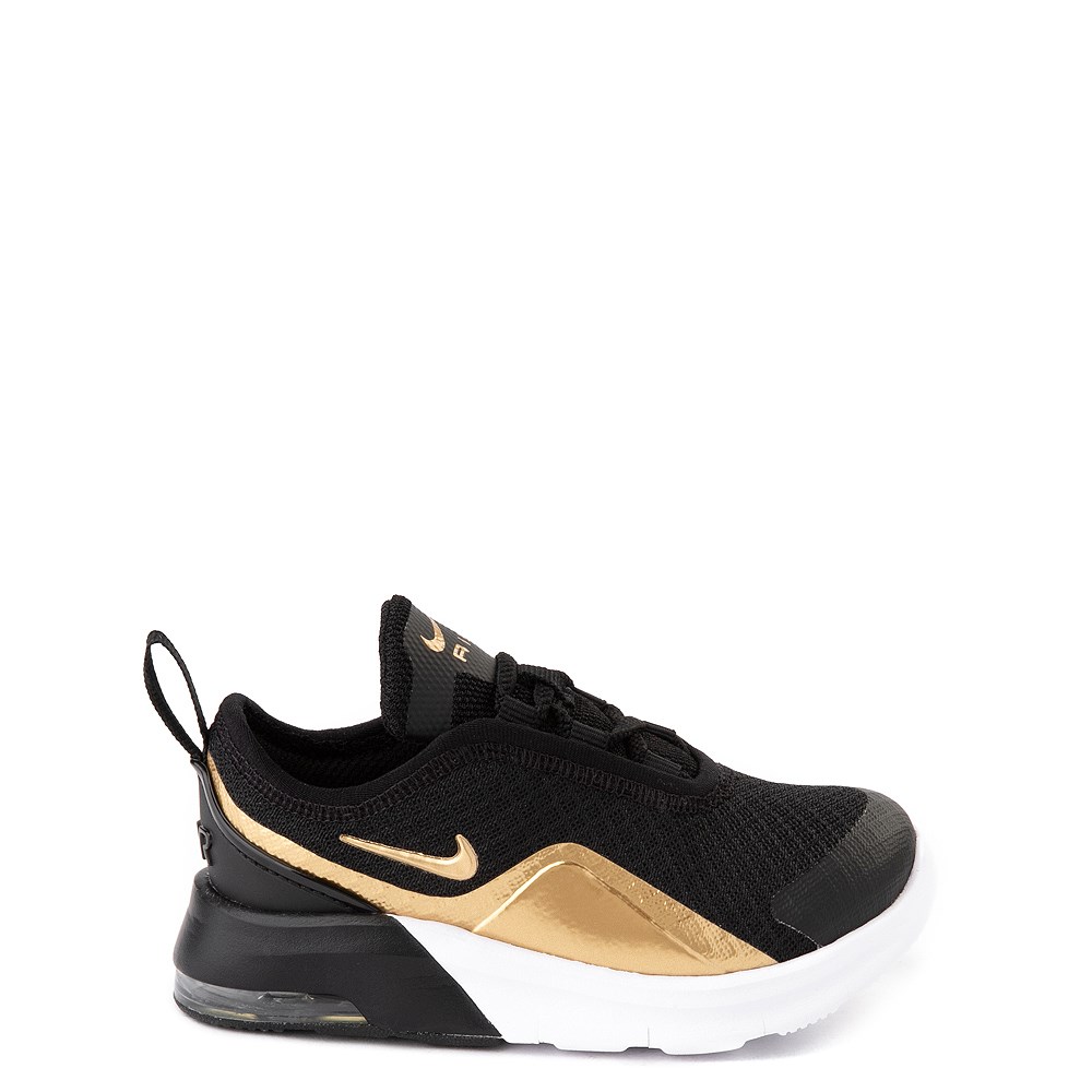gold and black nike air
